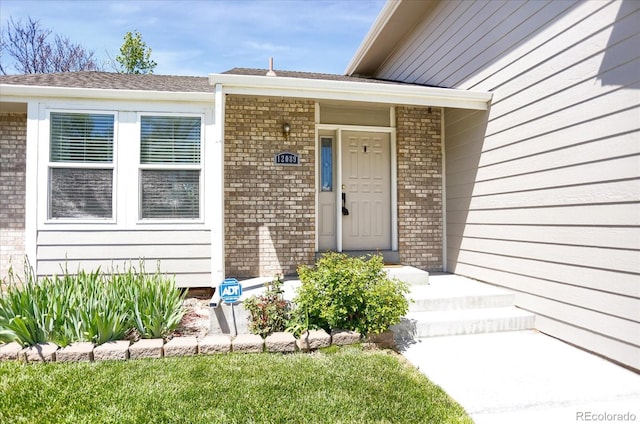 12089 W Burgundy Ave, Littleton, CO 80127 - entrance to property featuring brick siding