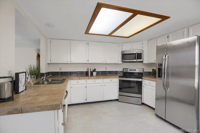 12089 W Burgundy Ave, Littleton, CO 80127 - kitchen with stainless steel appliances and white cabinets