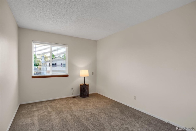 12089 W Burgundy Ave, Littleton, CO 80127 - carpeted spare room with a textured ceiling and baseboards