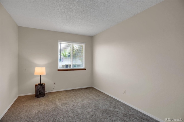 12089 W Burgundy Ave, Littleton, CO 80127 - spare room with carpet flooring and a textured ceiling