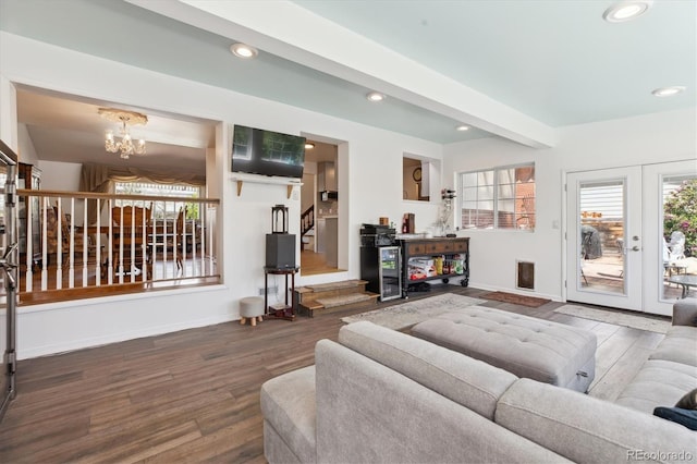 living room featuring baseboards, stairs, recessed lighting, and wood finished floors