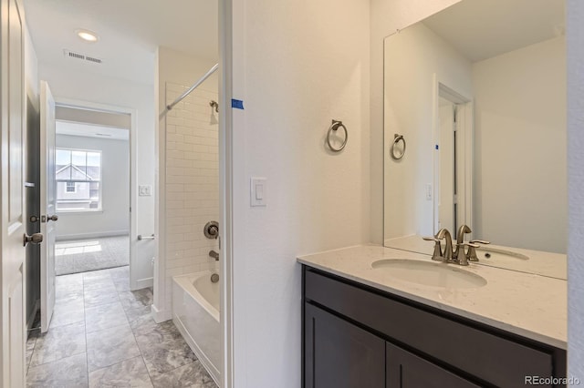 bathroom with  shower combination, visible vents, tile patterned flooring, and vanity
