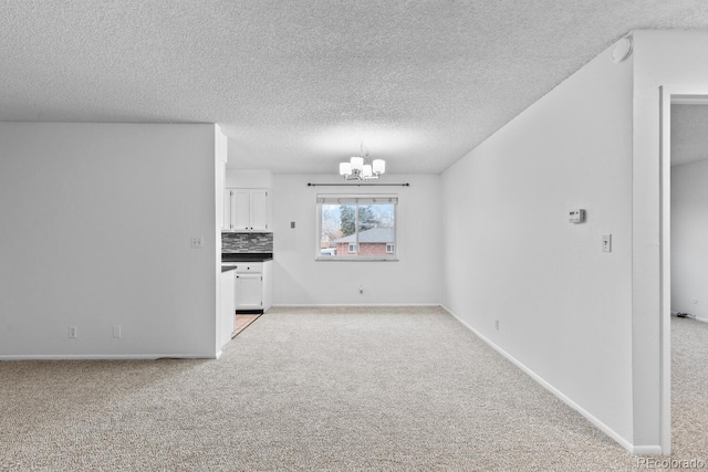 interior space featuring a textured ceiling and an inviting chandelier