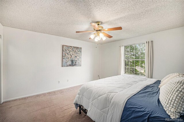 12632 James Ct, Broomfield, CO 80020 - bedroom featuring carpet, ceiling fan, and a textured ceiling