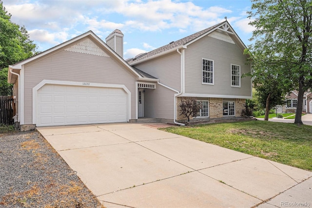 12632 James Ct, Broomfield, CO 80020 - view of front of home with an attached garage, driveway, and a chimney