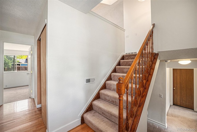 12632 James Ct, Broomfield, CO 80020 - stairway featuring wood finished floors