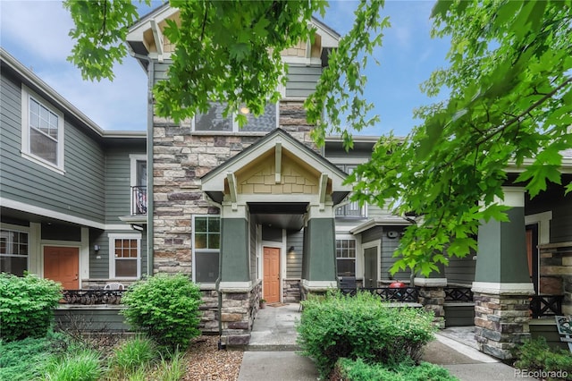 7140 Simms St Unit 102, Arvada, CO 80004 - view of front of property featuring stone siding