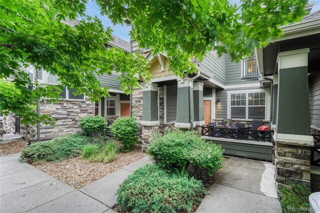 7140 Simms St Unit 102, Arvada, CO 80004 - property entrance featuring stone siding