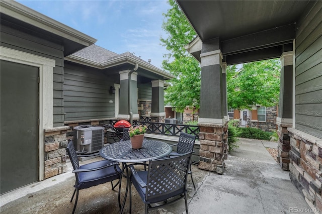 7140 Simms St Unit 102, Arvada, CO 80004 - view of patio / terrace with central AC and outdoor dining area