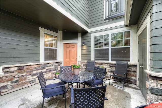 7140 Simms St Unit 102, Arvada, CO 80004 - view of patio / terrace featuring outdoor dining space