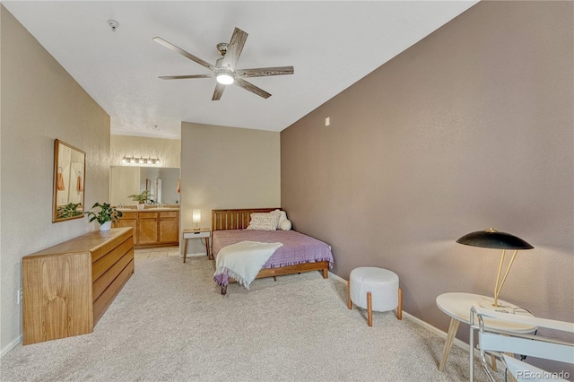 7140 Simms St Unit 102, Arvada, CO 80004 - bedroom featuring light carpet, connected bathroom, and baseboards