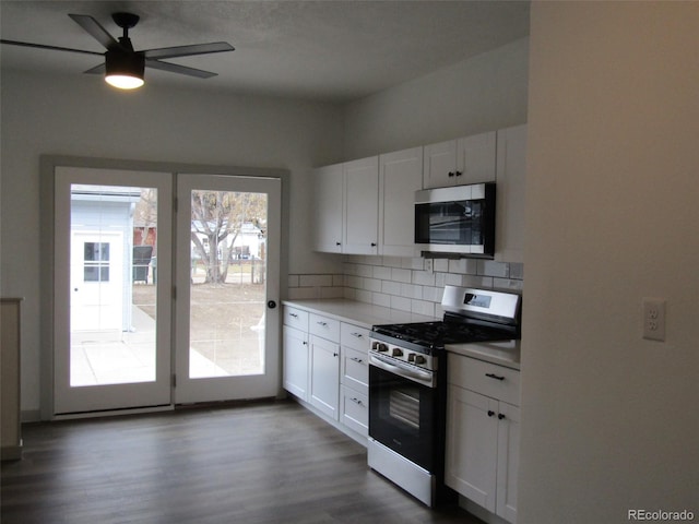 kitchen featuring white cabinets, ceiling fan, appliances with stainless steel finishes, and tasteful backsplash