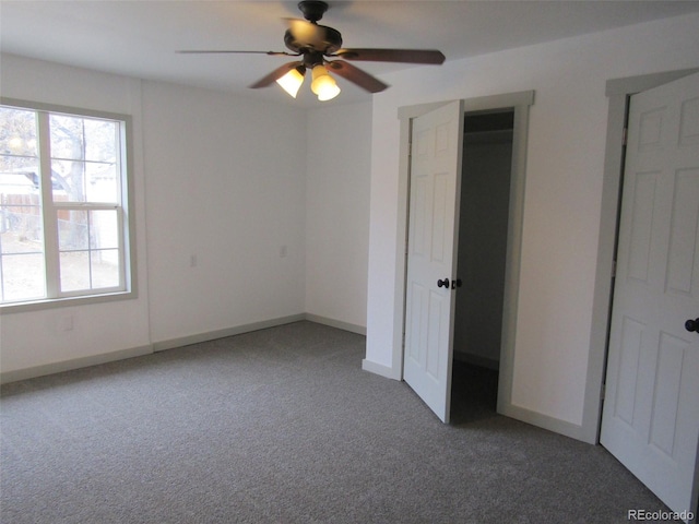 unfurnished bedroom featuring carpet flooring and ceiling fan