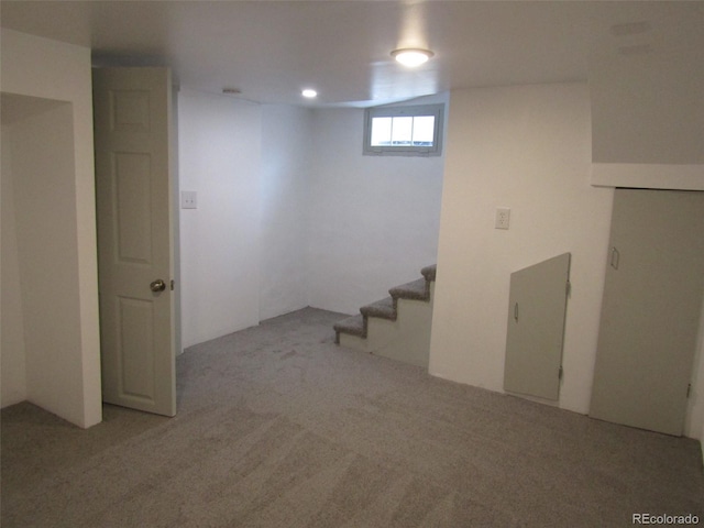 basement with light colored carpet