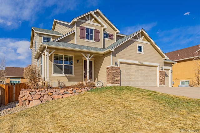 craftsman-style home featuring a front yard, fence, brick siding, and driveway