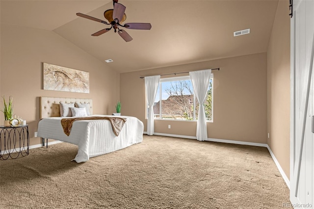 bedroom featuring lofted ceiling, baseboards, visible vents, and carpet floors