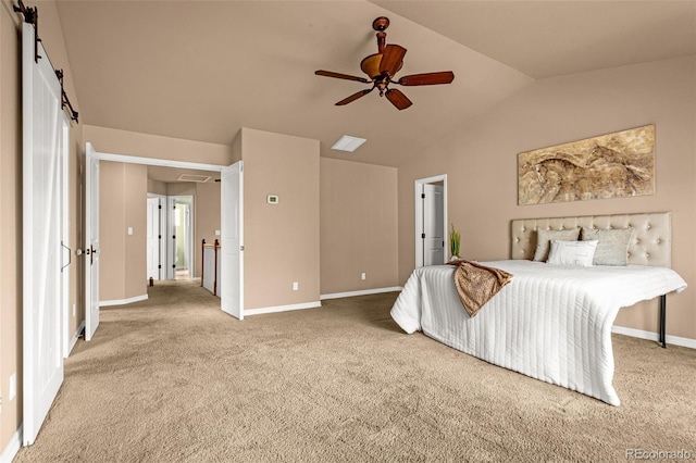 carpeted bedroom featuring visible vents, ceiling fan, baseboards, lofted ceiling, and a barn door