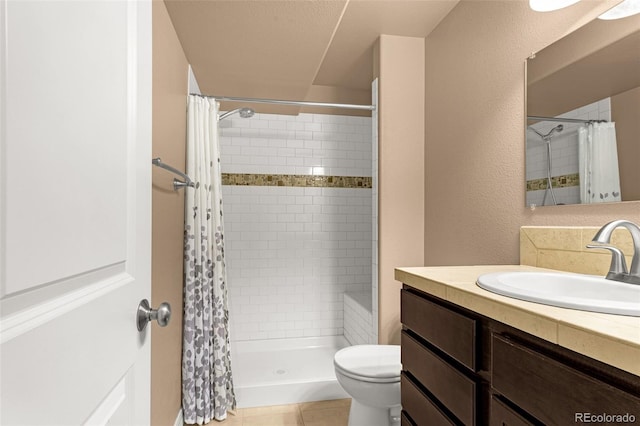 bathroom featuring vanity, a shower stall, toilet, and a textured wall