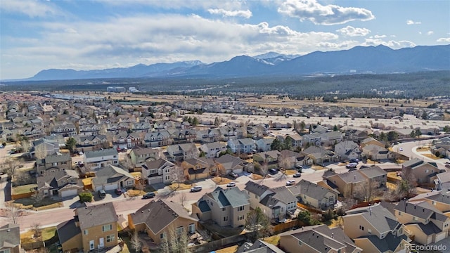 drone / aerial view featuring a residential view and a mountain view