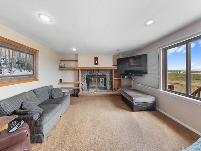 living room featuring carpet and a fireplace