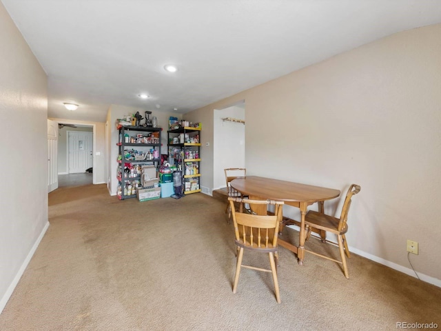 view of carpeted dining space