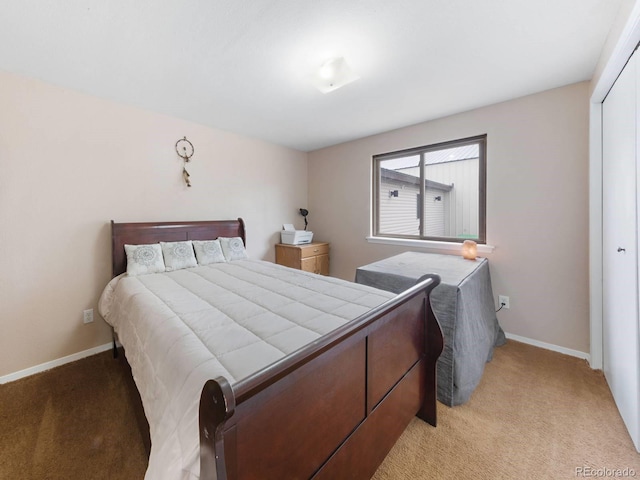 carpeted bedroom featuring a closet