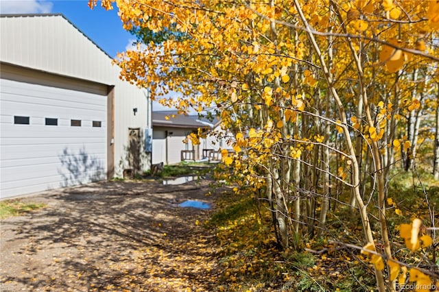 view of side of property with a garage