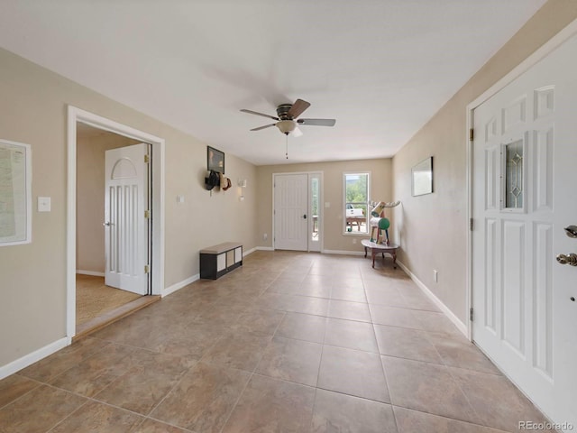 tiled foyer entrance featuring ceiling fan