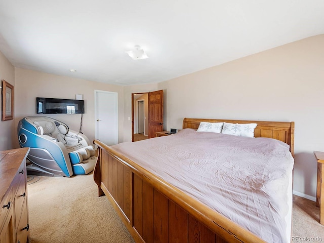 bedroom featuring light carpet