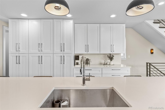 5101 Quitman St, Denver, CO 80212 - kitchen featuring a sink, white cabinetry, light countertops, and recessed lighting
