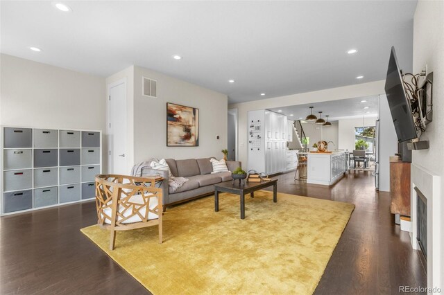 5101 Quitman St, Denver, CO 80212 - living room with dark wood-type flooring, recessed lighting, and a fireplace