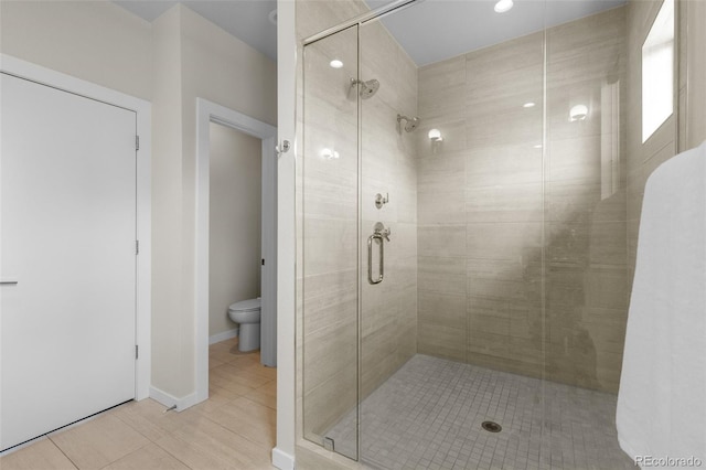 5101 Quitman St, Denver, CO 80212 - bathroom featuring a stall shower, toilet, tile patterned flooring, and baseboards