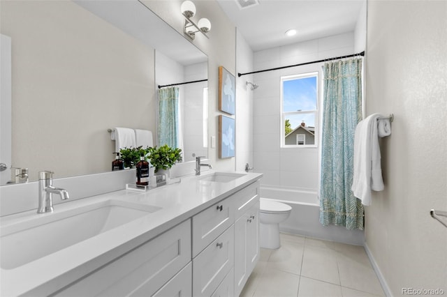 5101 Quitman St, Denver, CO 80212 - bathroom featuring tile patterned floors, double vanity, shower / bath combination with curtain, toilet, and baseboards