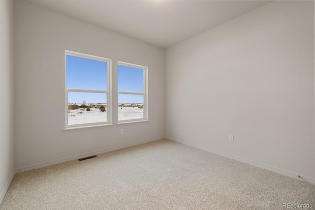 spare room featuring carpet floors