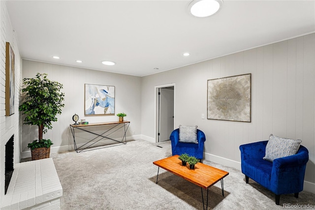 living area featuring carpet flooring, baseboards, and recessed lighting