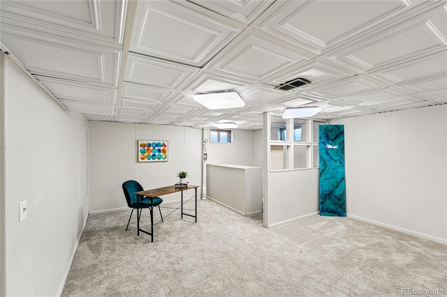 carpeted home office featuring baseboards