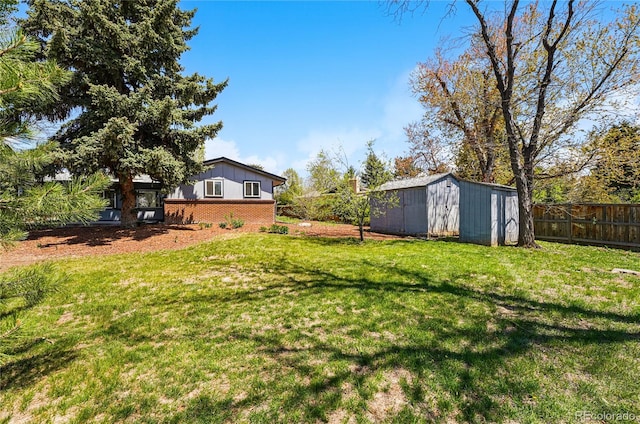 view of yard featuring a shed and an outbuilding