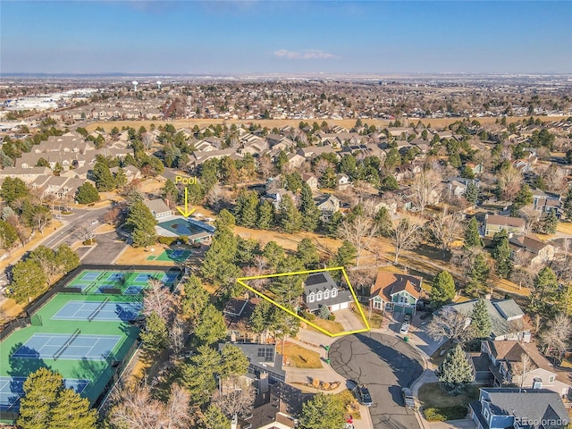 birds eye view of property with a residential view