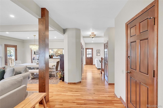 hall featuring a wealth of natural light, a chandelier, recessed lighting, and light wood finished floors