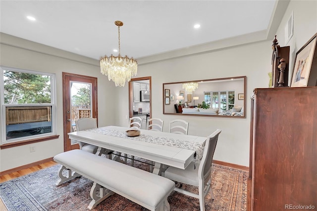 dining space with light wood finished floors, visible vents, baseboards, a chandelier, and recessed lighting