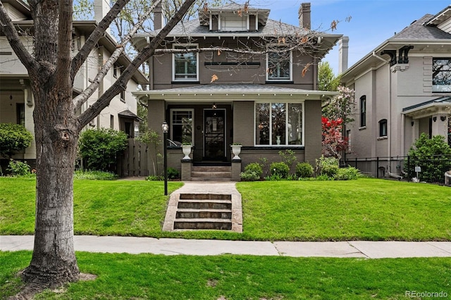 american foursquare style home with brick siding and a chimney