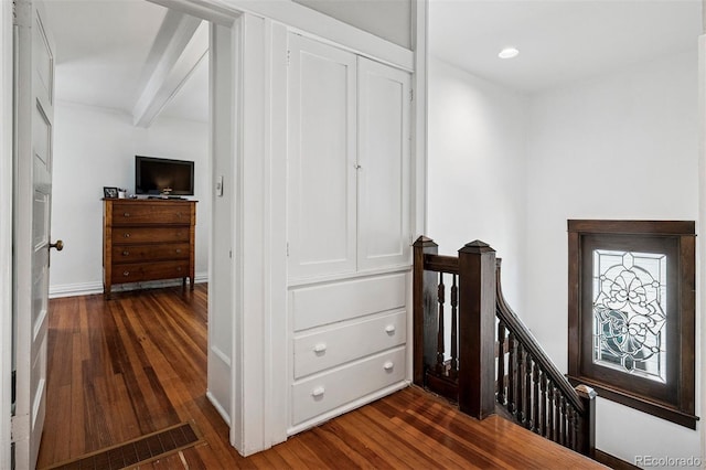 stairway with hardwood / wood-style flooring, baseboards, beam ceiling, and recessed lighting