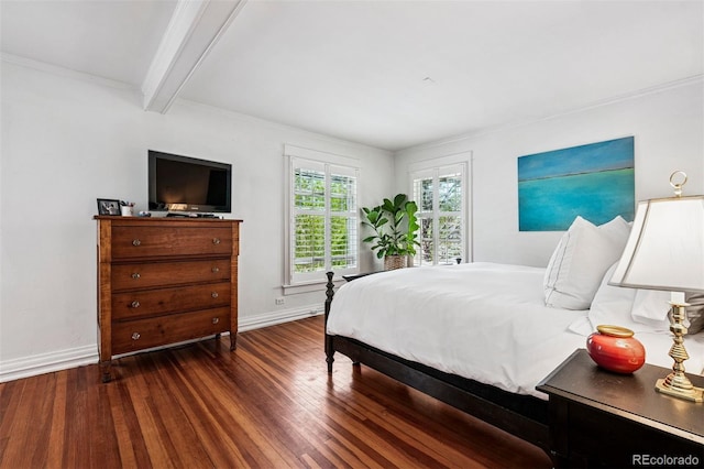 bedroom featuring wood finished floors, baseboards, beam ceiling, and ornamental molding
