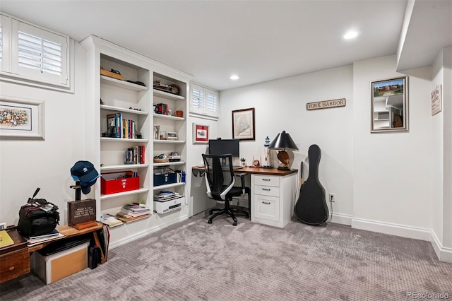 office space featuring light carpet, recessed lighting, and baseboards