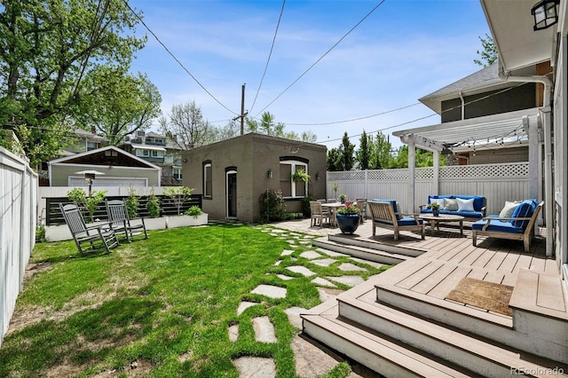 view of yard featuring outdoor lounge area, an outbuilding, and a pergola