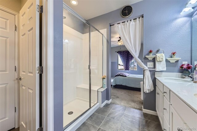 6924 E 118th Pl, Thornton, CO 80233 - full bathroom featuring a shower stall, vanity, connected bathroom, a ceiling fan, and a textured wall