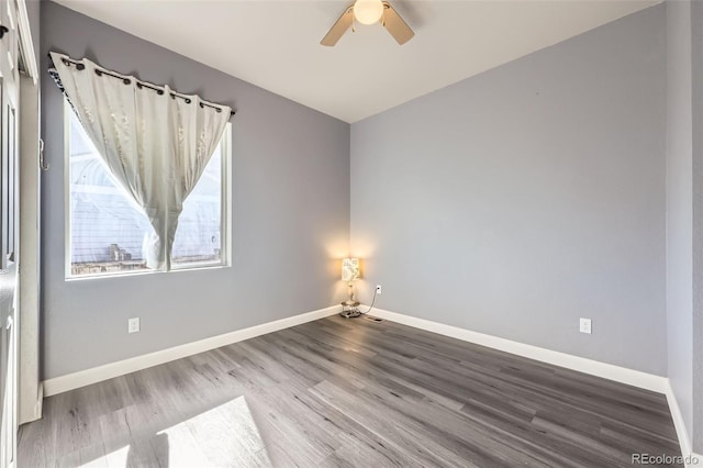 6924 E 118th Pl, Thornton, CO 80233 - spare room featuring a ceiling fan, wood finished floors, and baseboards