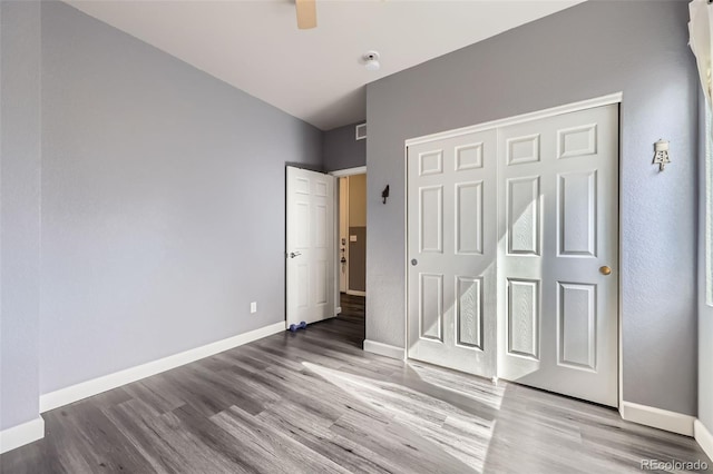 6924 E 118th Pl, Thornton, CO 80233 - unfurnished bedroom with wood finished floors, baseboards, a closet, and ceiling fan