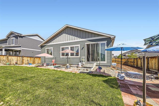 6924 E 118th Pl, Thornton, CO 80233 - rear view of house featuring board and batten siding and entry steps