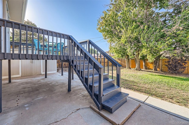 view of patio / terrace with stairway and fence